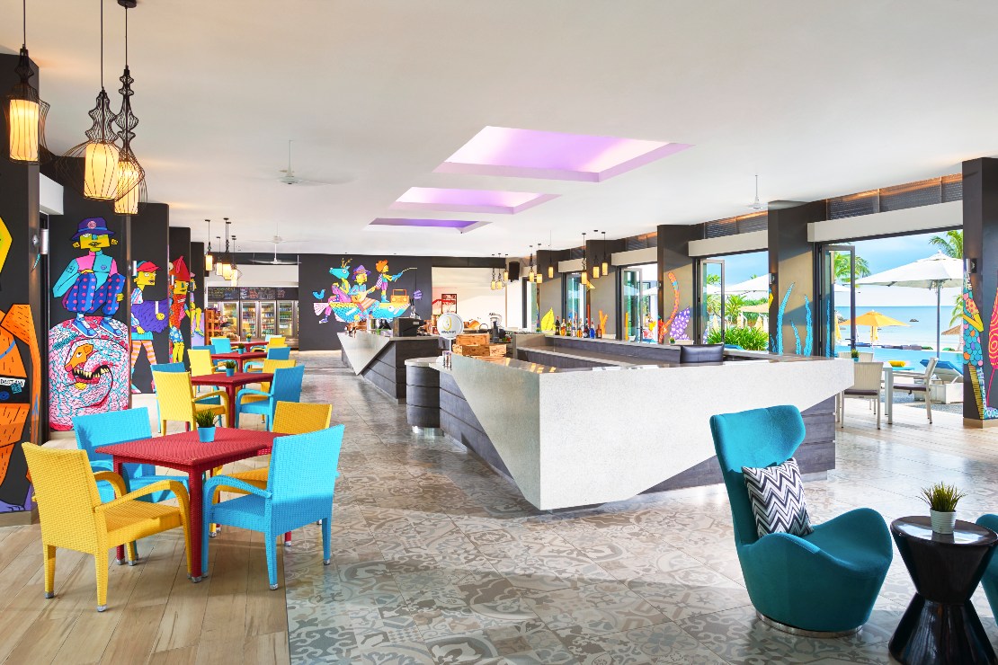 The bright and colourful lights and interiors in Cassia Bintan’s open-concept lobby